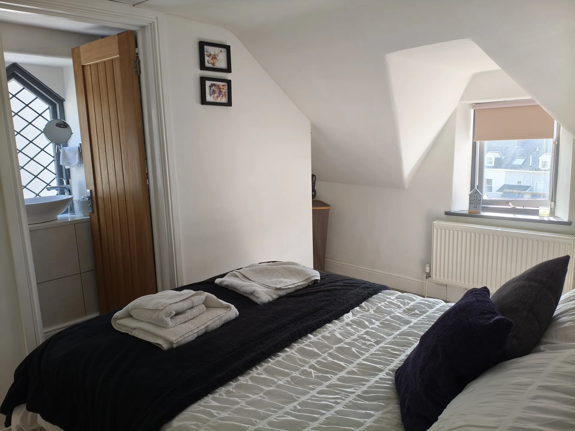 Master bedroom showing ensuite door and two windows