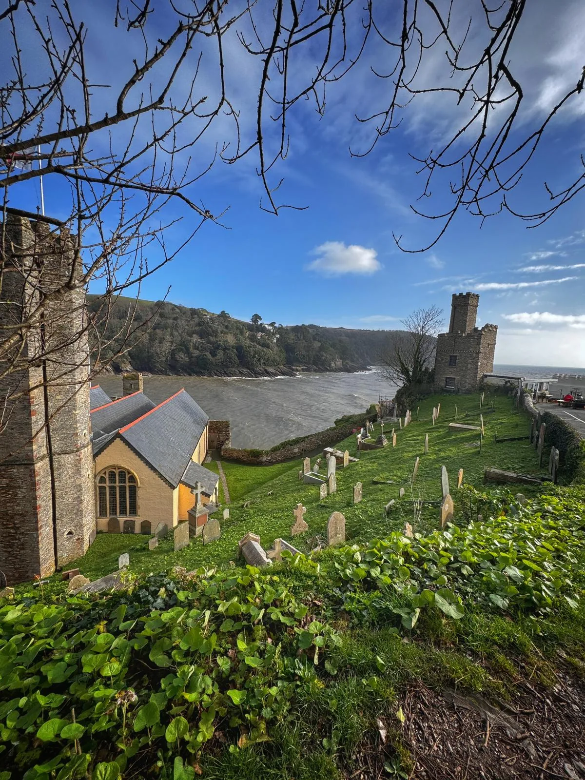 St Petrox churchyard with estuary views and castle tower