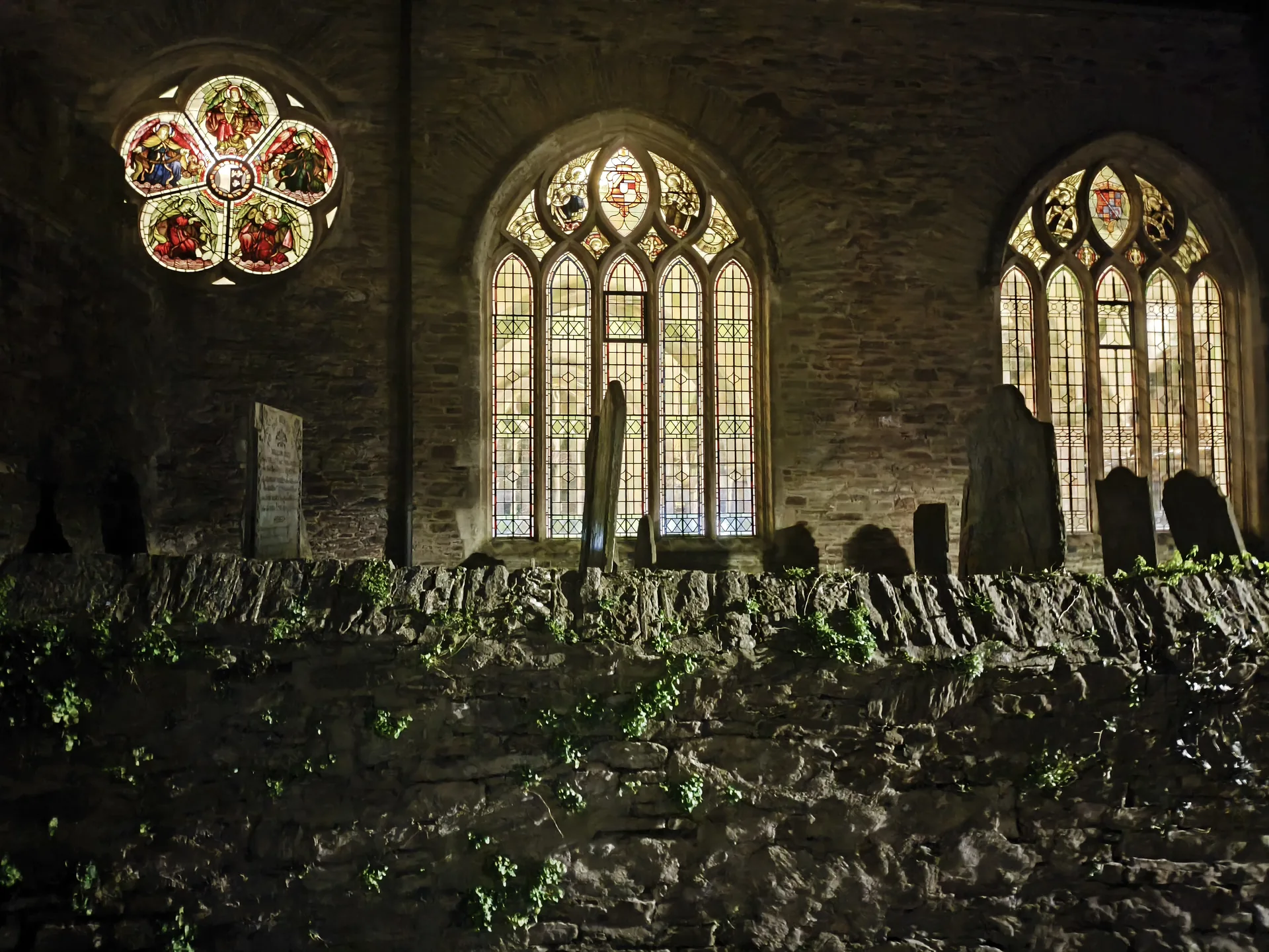 St Petrox Church interior with stained glass windows
