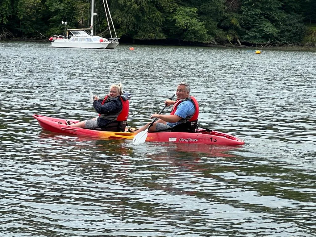 Two people kayaking on the River Dart