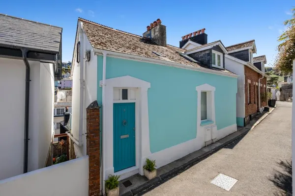 Diddy House — the distinctive teal-blue exterior