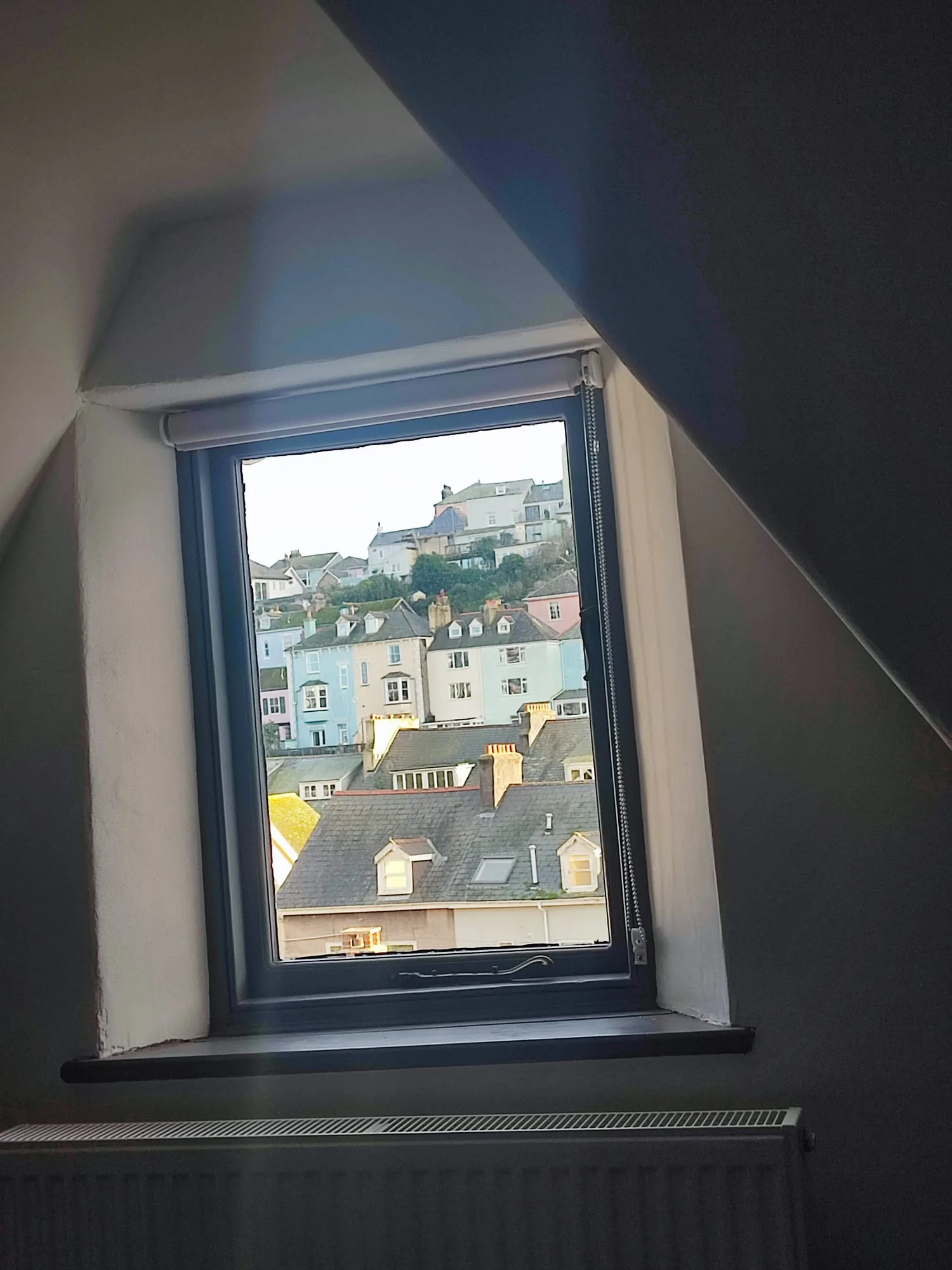 Skylight window framing Dartmouth's colourful houses
