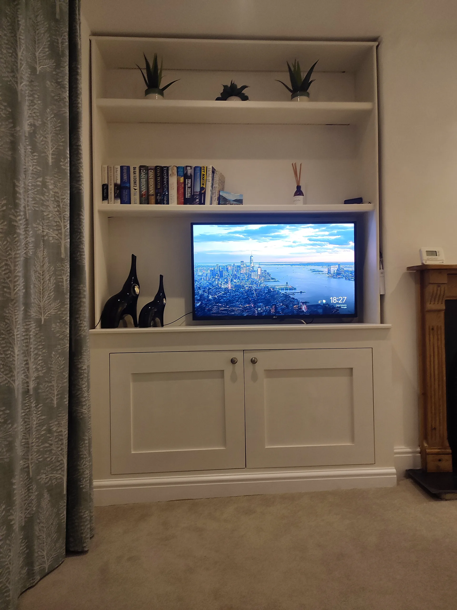 Smart TV in built-in alcove with bookcase